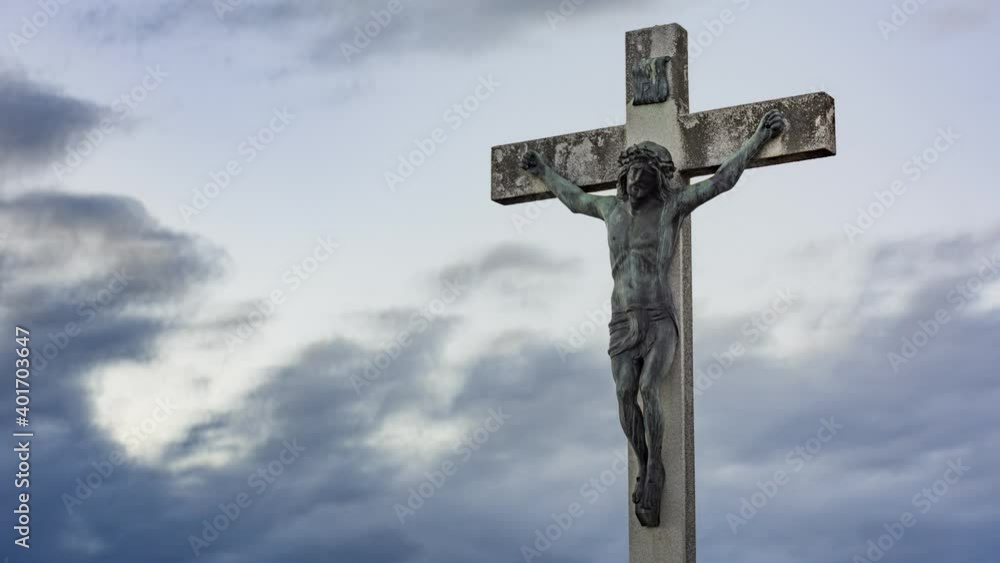 Jesus Christ on the cross against dramatic cloudy sky. Crucifixion, religion and spirituality 4K timelapse Jesus Christ on the cross against dramatic cloudy sky. Crucifixion, religion and spirituality 4K timelapse