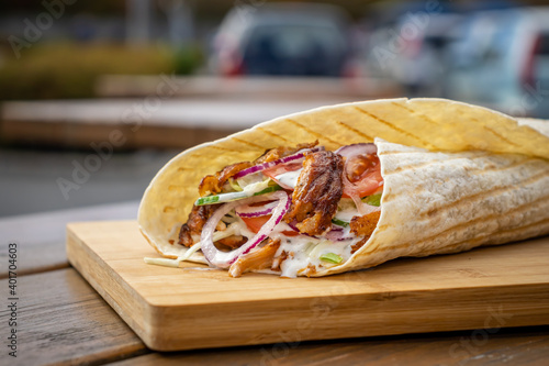 Durum Kebab at a local street food stall on wooden cutting board