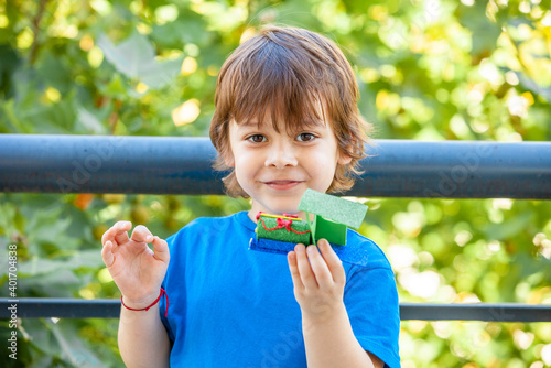 portrait of a little boy with a toy in his hands