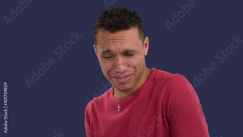 Curious multiethnic man nauseated by a disgusting smell gags and coughs