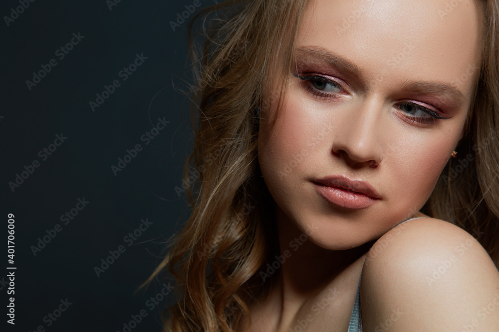 Beautiful woman's face with tan. clean skin - isolated on black Beautiful woman's face with tan. clean skin - isolated on black
