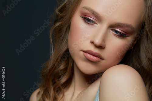 Beautiful woman's face with tan. clean skin - isolated on black