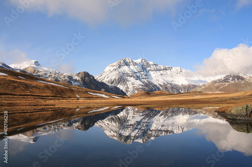Amazing reflections in lake Plan du Lac Bellecombe looking towards La Grande Casse in the French alps  © Picturereflex