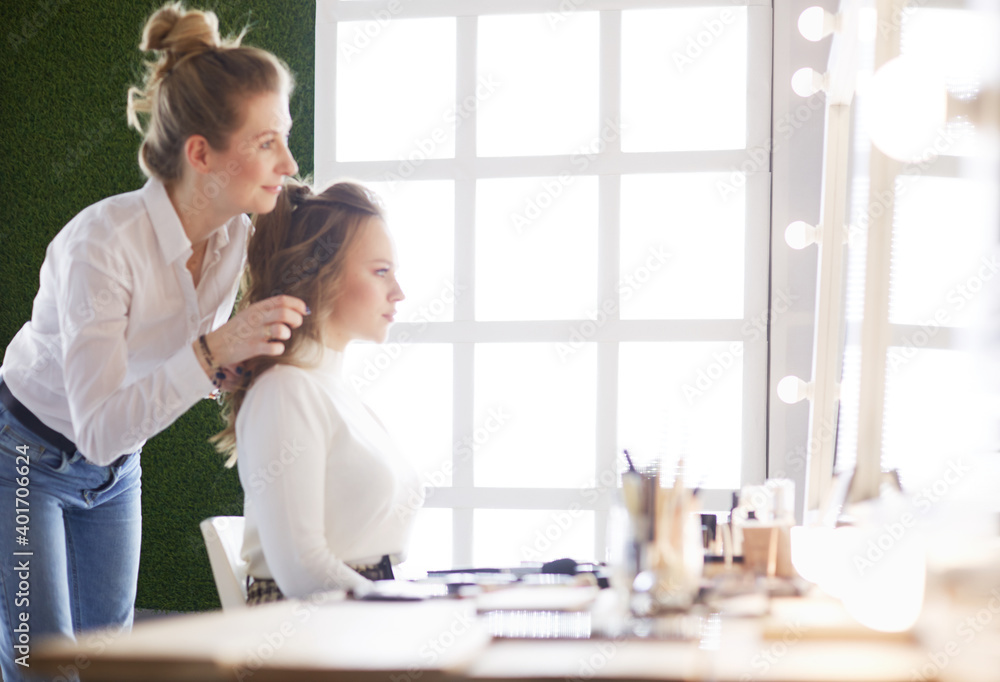 make up artist doing professional make up of young woman make up artist doing professional make up of young woman