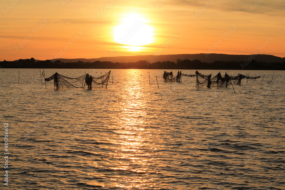 Beautiful sunset in the Fishing village of Villeneuve les Maguelone, a seaside resort in the south of Montpellier, Herault, France Beautiful sunset in the Fishing village of Villeneuve les Maguelone, a seaside resort in the south of Montpellier, Herault, France