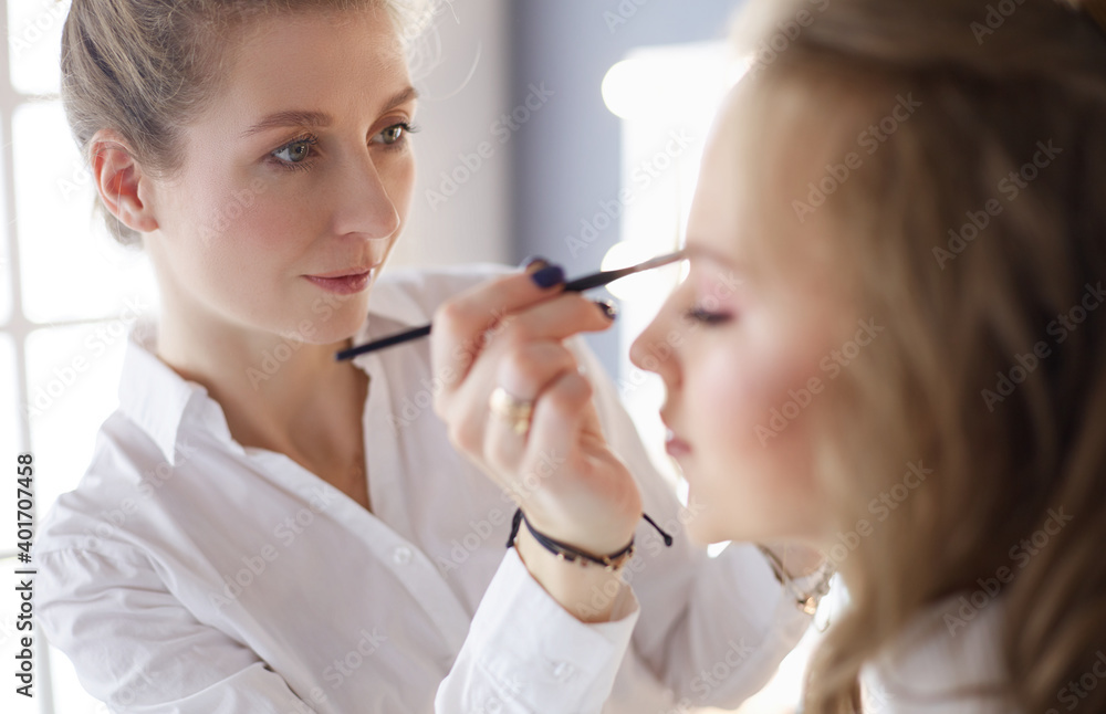 beautiful young model woman getting fashion make-up beautiful young model woman getting fashion make-up