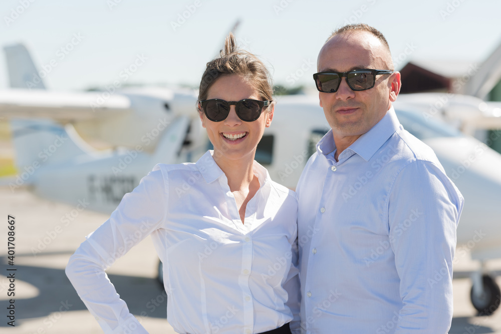 couple boarding airplane in hanger couple boarding airplane in hanger