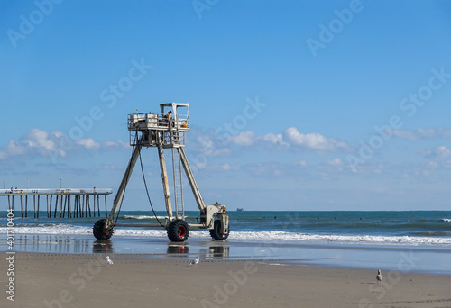 An amphibious buggy tower used for beach replenishment is seen entering the ocean