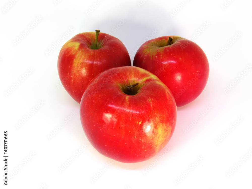 Three red-yellow apple on white background. Three red-yellow apple on white background.