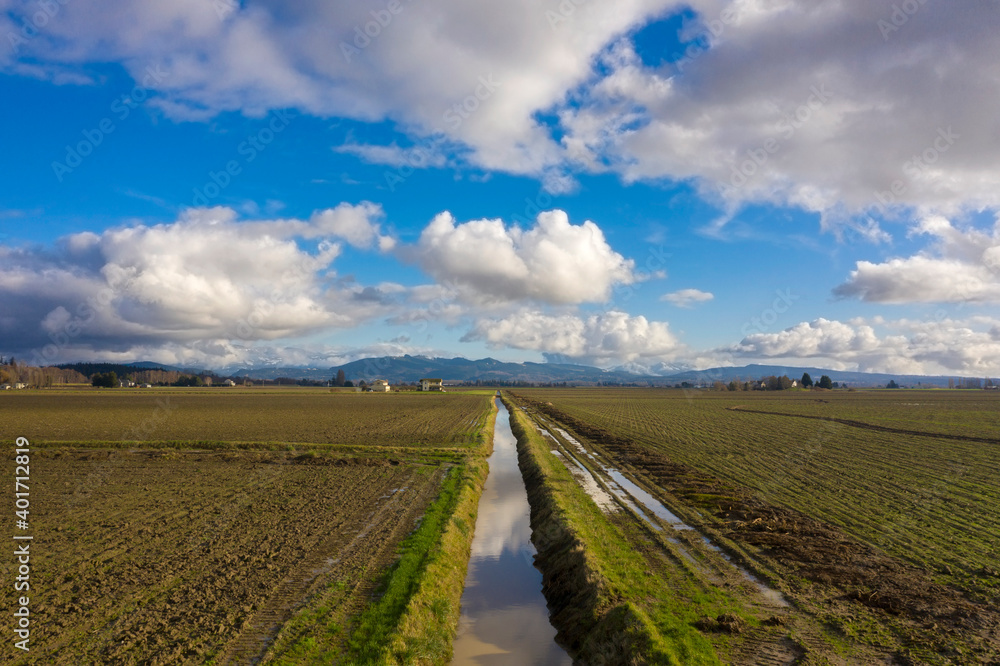 Irrigation Ditch in the Skagit Valley, Washington. Skagit County maintains one of the largest and most diverse agricultural communities west of the Cascade mountain range. Irrigation Ditch in the Skagit Valley, Washington. Skagit County maintains one of the largest and most diverse agricultural communities west of the Cascade mountain range.