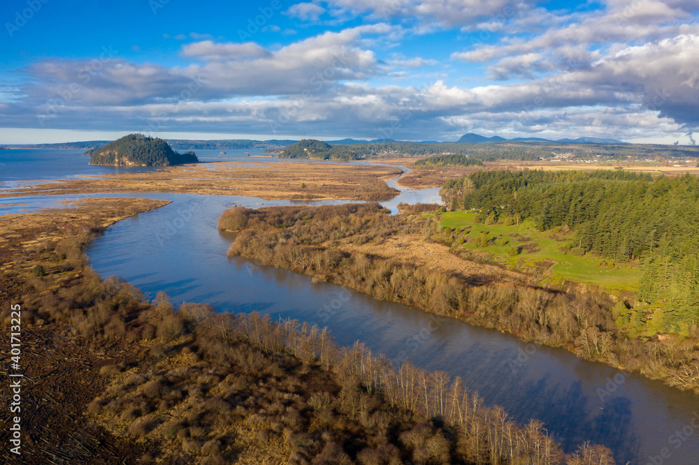 Aerial View of the North Fork of the Skagit River. Drone view of the north fork of the Skagit River running through the valley delta near Conway, Washington. The Skagit Wild and Scenic River System.