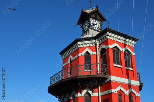 Top part of red Victorian Gothic-style Clock Tower (the original Port Captain's Office) at V&A Waterfront in Cape Town