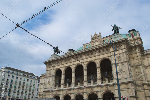 Telephone cables in front of the Wiener Staatsoper (The Vienna State Opera) in Vienna, Austria. Renaissance revival architecture contrasting with contemporary electric urban infrastructure