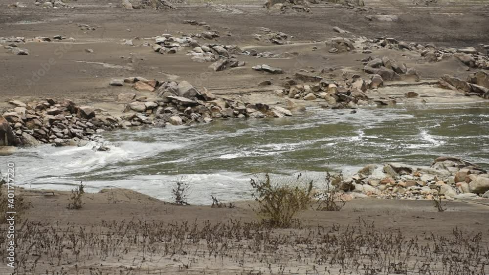 river flowing through landscape, with low water levels river flowing through landscape, with low water levels