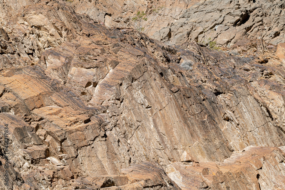 Striated rock patterns of the Titus Canyon Wall in Death Valley National Park, California, USA Striated rock patterns of the Titus Canyon Wall in Death Valley National Park, California, USA