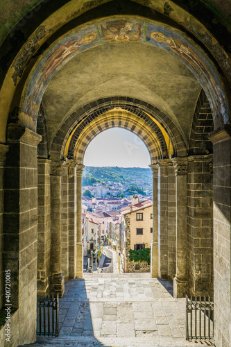 View from the main door of the Cathedral of Our Lady of the Annunciation or Cathedrale Notre-Dame du Puy on the medieval streets of the old town of Le Puy en Velay  Auvergne  France