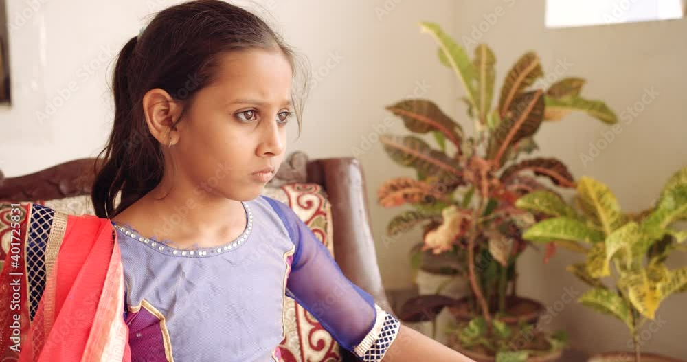 Girl at home during quarantined looks around lost lonely bored isolated suspicious apprehensive worried because of new normal coronavirus pandemic social and physical distancing Girl at home during quarantined looks around lost lonely bored isolated suspicious apprehensive worried because of new normal coronavirus pandemic social and physical distancing