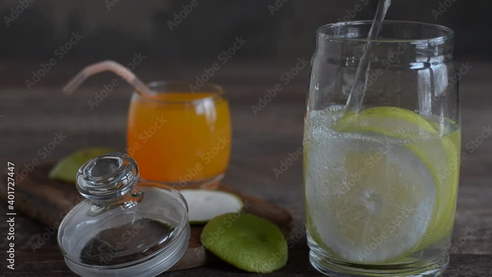 Cooking homemade lemonade from citrus fruits, on a rustic background. Selective focus Cooking homemade lemonade from citrus fruits, on a rustic background. Selective focus