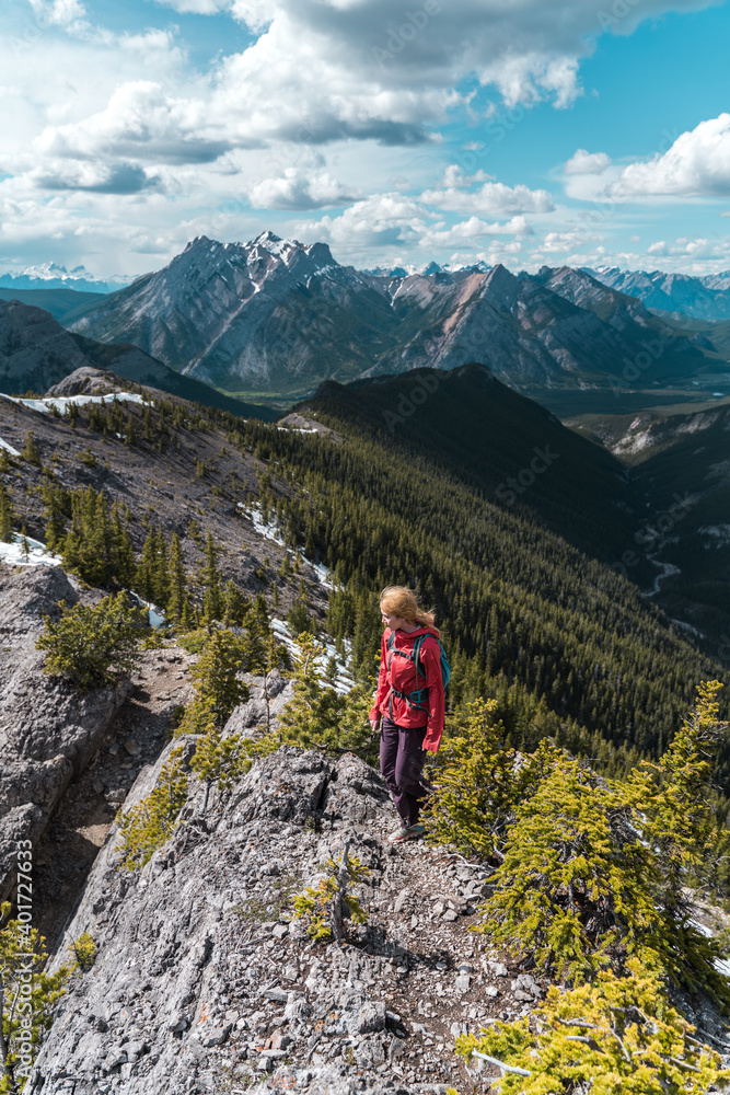Woman hiking on mountain ridge