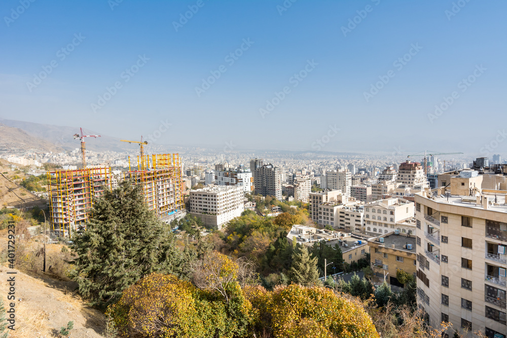 City view of Tehran City with modern buildings, Iran , view form mountain Tochal climbing route.