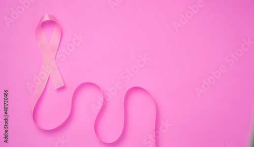 breast cancer awareness ribbon on pink background © Golden House Images