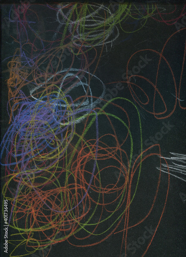 drawing doodles with crayons on a black background