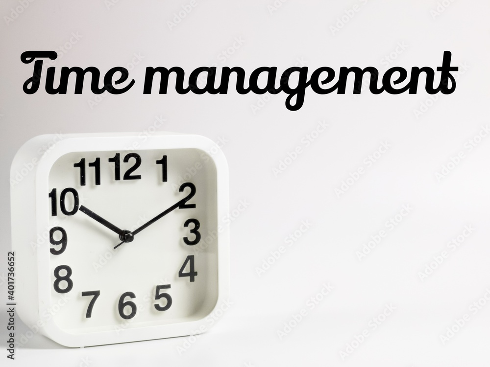 Selective focus on alarm clock with text time management isolated on white background.Education and business concept. Selective focus on alarm clock with text time management isolated on white background.Education and business concept.