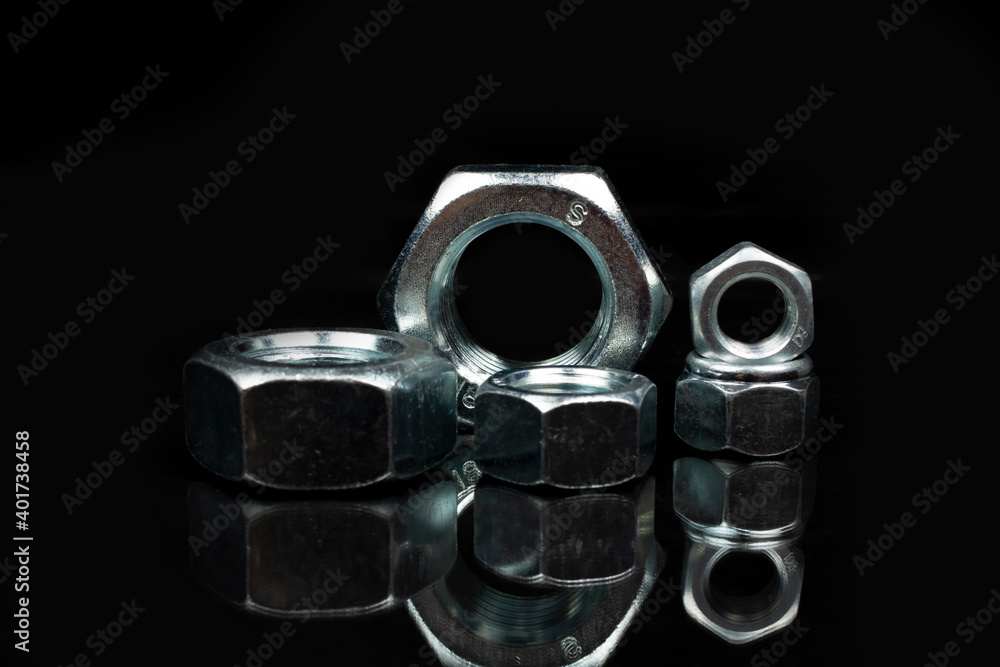 group of large metal nuts close up group of large metal nuts close up