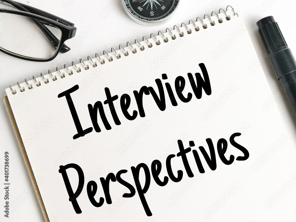Fototapeta premium Text INTERVIEW PERSPECTIVES on notebook with marker pen, eye glasses and compass.Business concept.