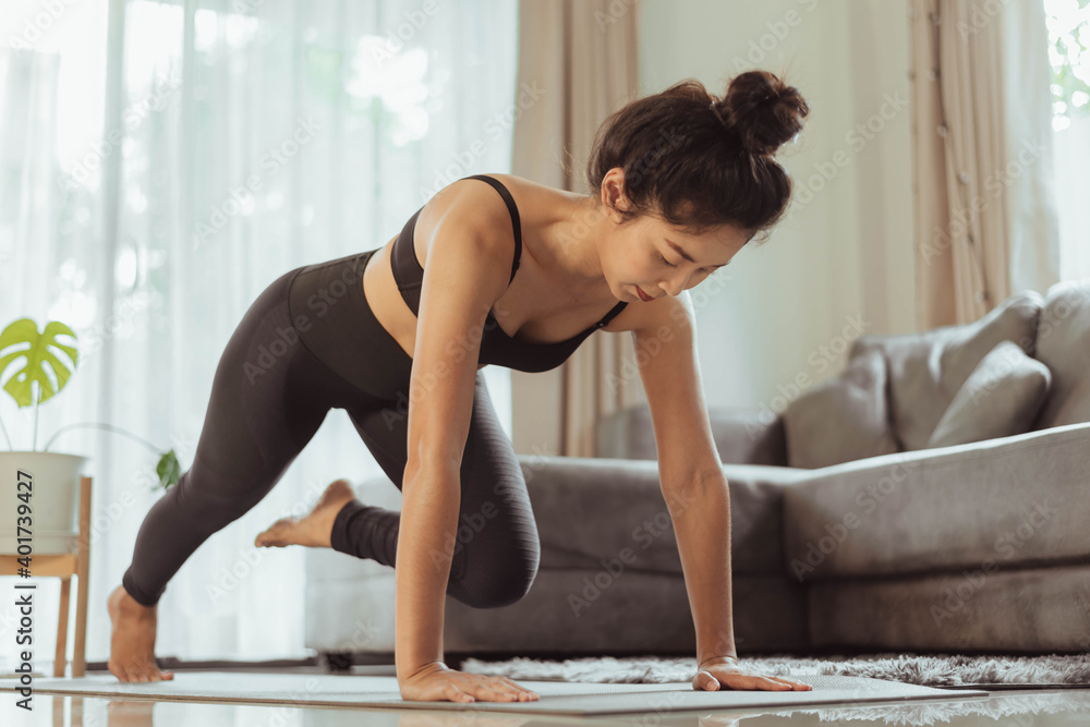 Young Training at home, woman in sportswear doing workout at home. Young Training at home, woman in sportswear doing workout at home.