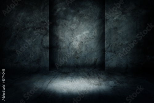 Abstract image of Studio dark room concrete floor grunge texture background with lighting effect.