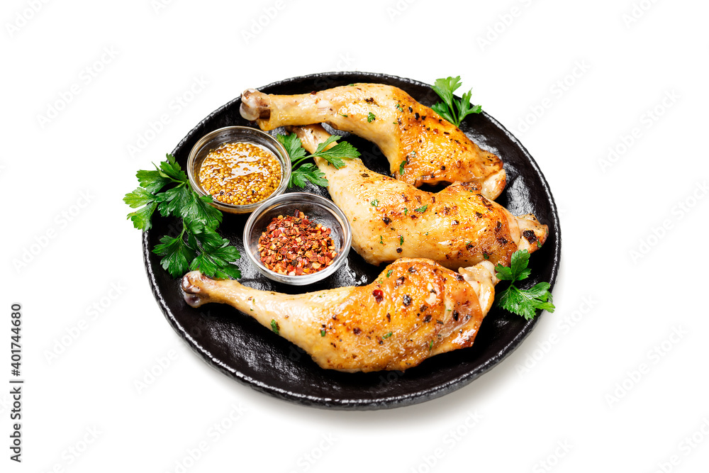 Grilled chicken legs with spices isolated on white background Grilled chicken legs with spices isolated on white background