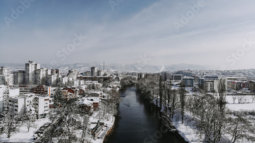 An aerial shot of the city of Banjakuka covered with snow at daytime photo