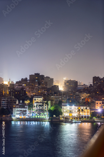 Aerial view of the city of Cairo at night along the river Nile. Skyline of the African city of Egypt © unai