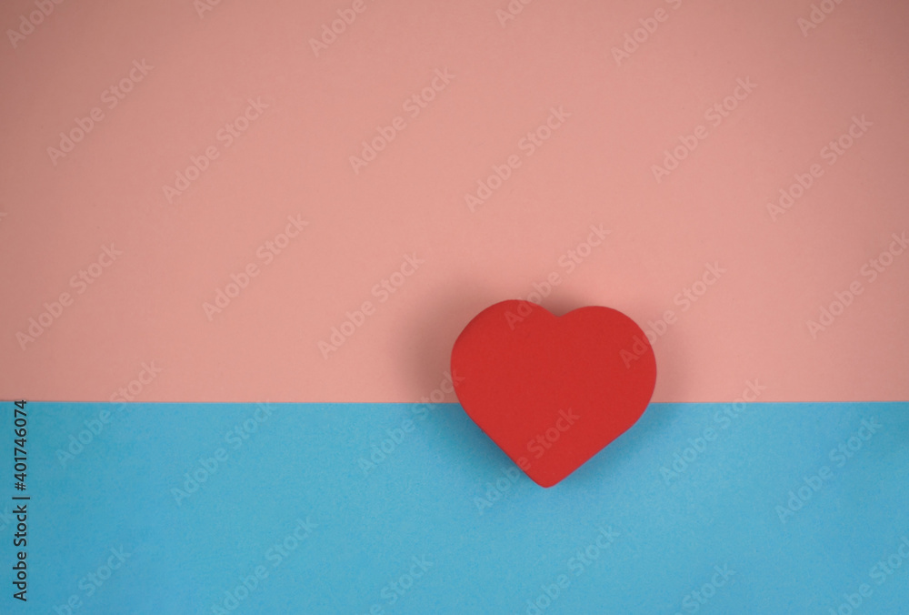one red heart on blue and pink background