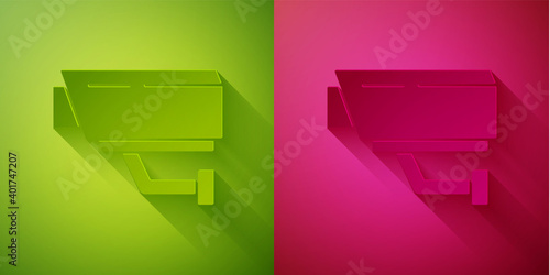 Paper cut Security camera icon isolated on green and pink background. Paper art style. Vector.
