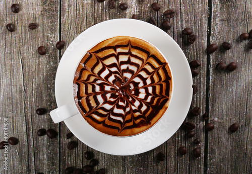 hot beverage coffee cappuccino wooden background with coffee beans 