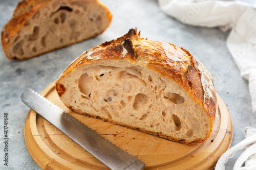 Sourdough bread slices, on a cutting board. Organic homemade bread.