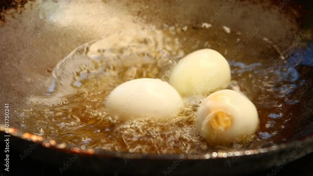 Frying boiled eggs in pan, indoor Chiangmai Thailand. Frying boiled eggs in pan, indoor Chiangmai Thailand.