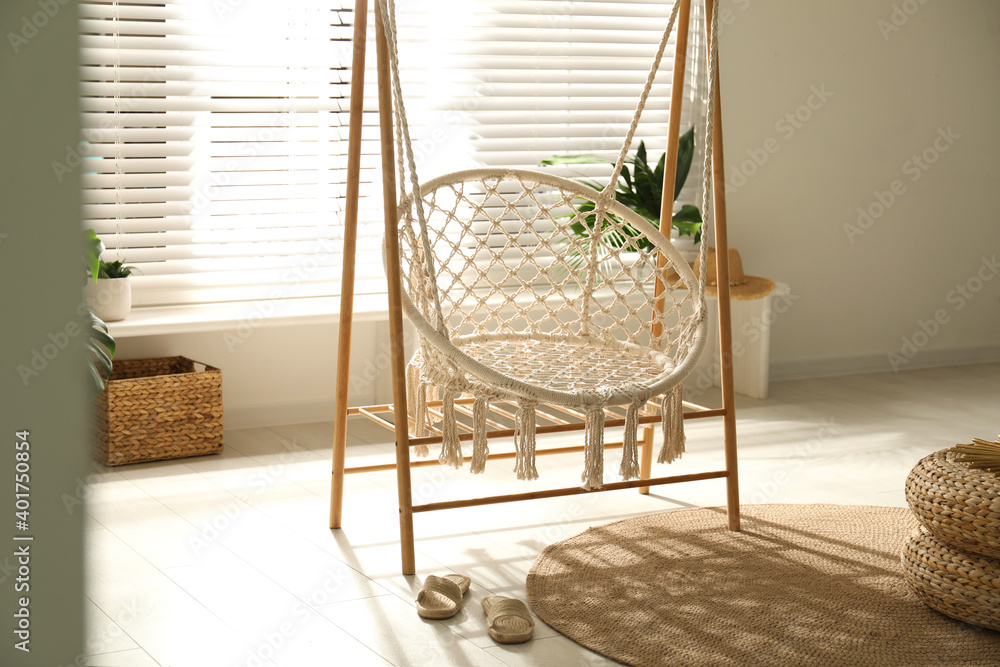 Comfortable hammock chair in stylish room. Interior design Comfortable hammock chair in stylish room. Interior design