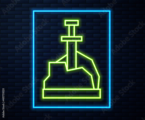 Glowing neon line Sword in the stone icon isolated on brick wall background. Excalibur the sword in the stone from the Arthurian legends. Vector.