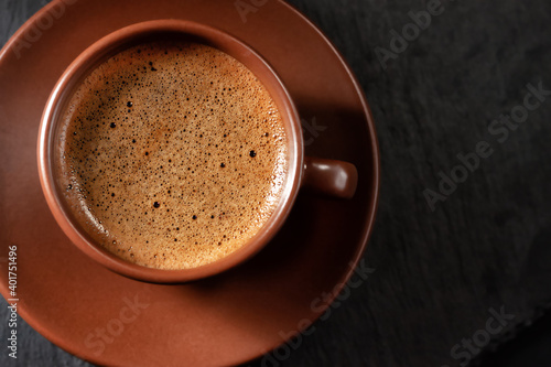 Coffee cup on stone background. Top view with copy space for your text