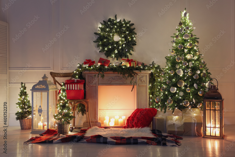 Beautiful Christmas themed photo zone with fireplace and fir decor Beautiful Christmas themed photo zone with fireplace and fir decor
