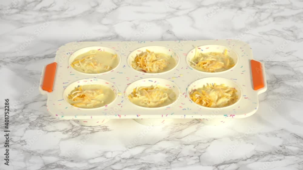 Step by step. Filling silicone muffin pan with ingredients to bake bacon and cheese egg muffin. Step by step. Filling silicone muffin pan with ingredients to bake bacon and cheese egg muffin.