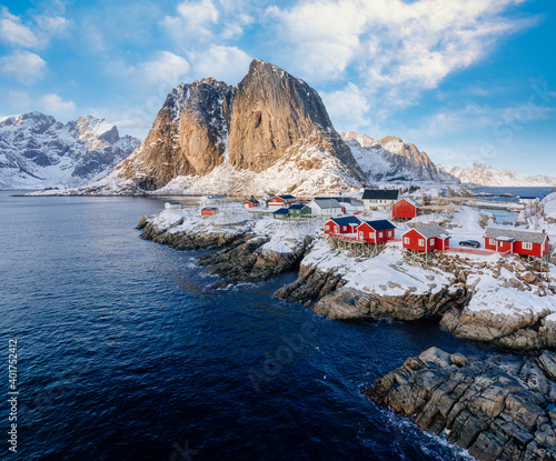 Hamnoy , Lofoten, Norway. Fisherman's Village with snow and red houses photo