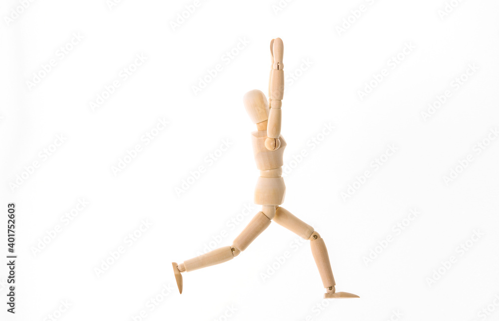 Wooden puppet practicing yoga asana pose isolated on white background Wooden puppet practicing yoga asana pose isolated on white background
