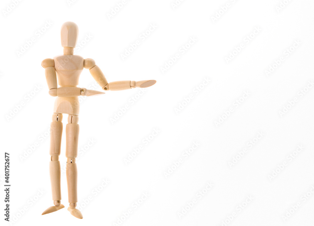 Wooden puppet mannequin shows on space for your text isolated on white background. Copy space Wooden puppet mannequin shows on space for your text isolated on white background. Copy space