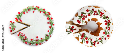 Decorated traditional Christmas cakes on white background, top view. Banner design
