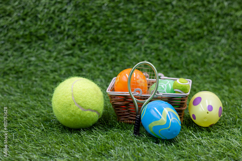 Tennis ball for Easter decoration with tennis ball on green grass