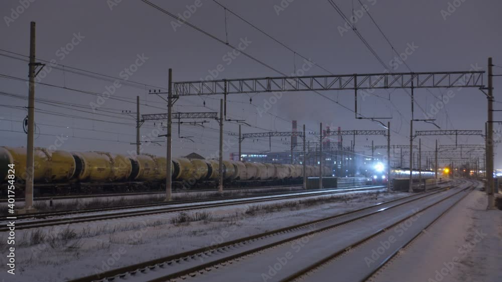 Arrival of the commuter train on a winter evening in St. Petersburg. Russia Arrival of the commuter train on a winter evening in St. Petersburg. Russia